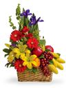 Cesto in vimini di frutta e fiori